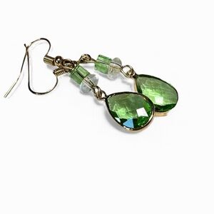 Pretty soft green peridot color earrings in gold tone
